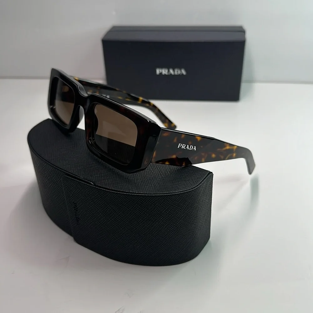Prada PR06YS Brown Sunglasses with Bold Frames and UV Protection
